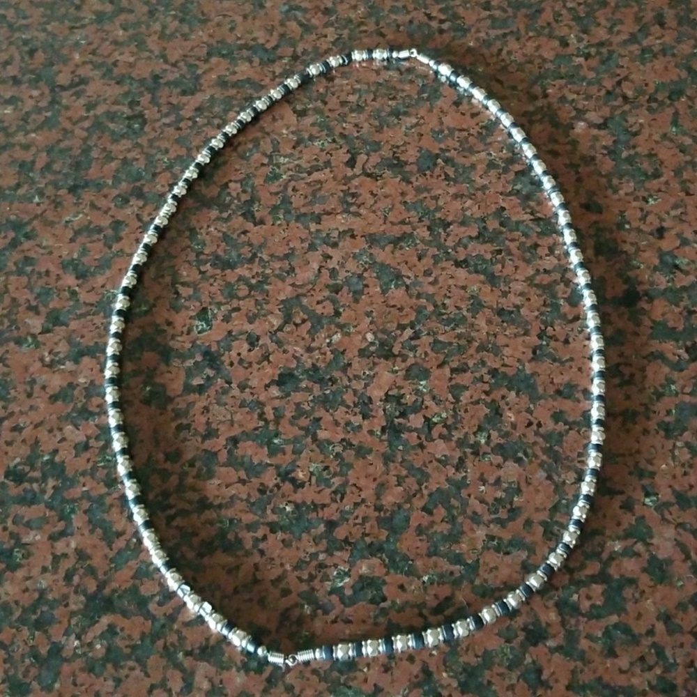 Silver and black beaded necklace.